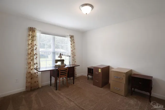 a view of a workspace with furniture