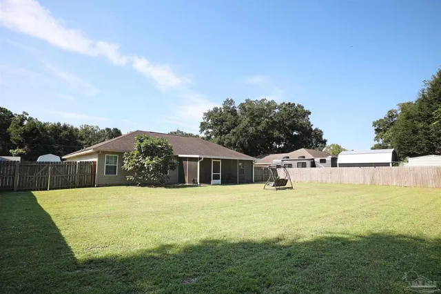 a view of swimming pool with a yard