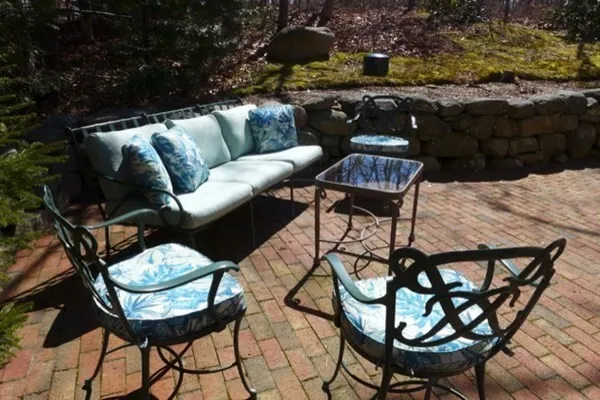 a balcony with a table and chairs