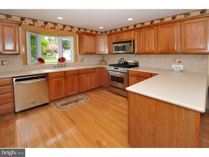 85 Kent Road Huntingdon Valley, PA 19006 - Photo 14 of 25 a kitchen with stainless steel appliances granite countertop a sink a stove top oven a counter space and cabinets