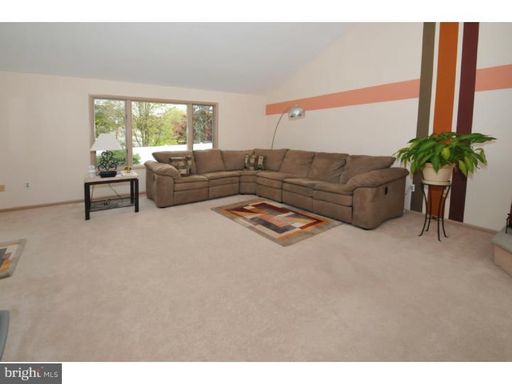 85 Kent Road Huntingdon Valley, PA 19006 - Photo 17 of 25 a living room with furniture and a large window