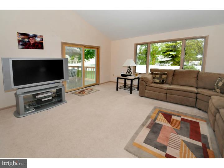 85 Kent Road Huntingdon Valley, PA 19006 - Photo 18 of 25 a living room with furniture and a flat screen tv