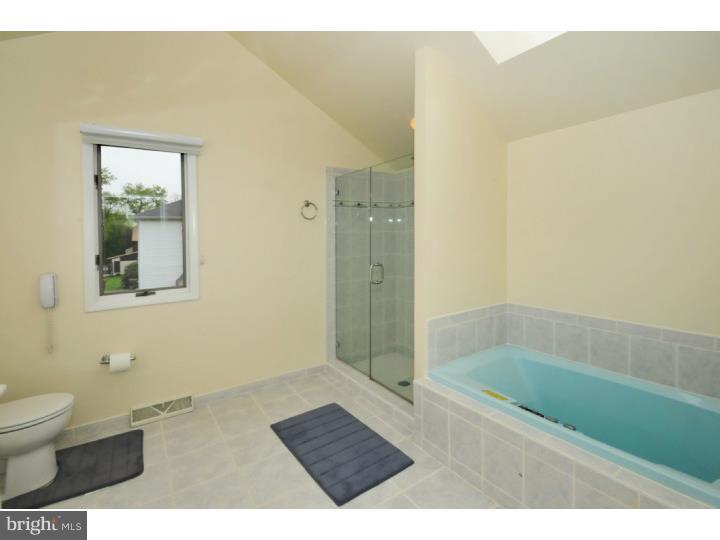 85 Kent Road Huntingdon Valley, PA 19006 - Photo 22 of 25 a bathroom with a granite countertop sink a toilet and shower