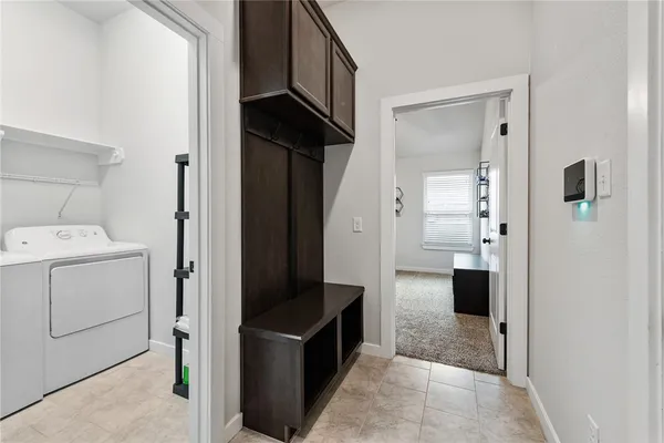 a view of hallway with washer and dryer