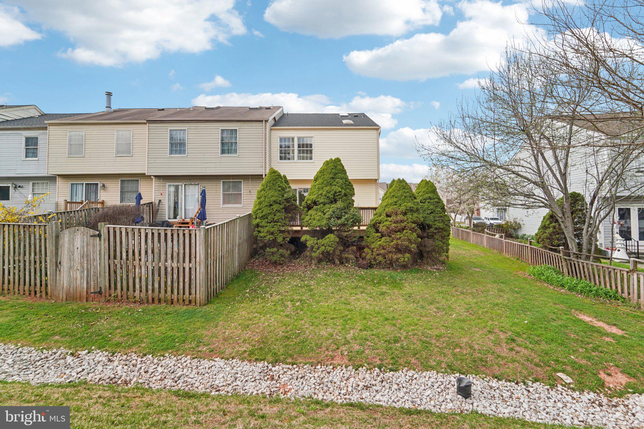 8727 Silver Hall Road Perry Hall, MD 21128 - Photo 25 of 35 a view of a house with a yard and deck