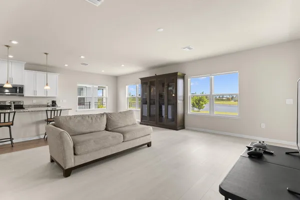 a living room with furniture and a large window
