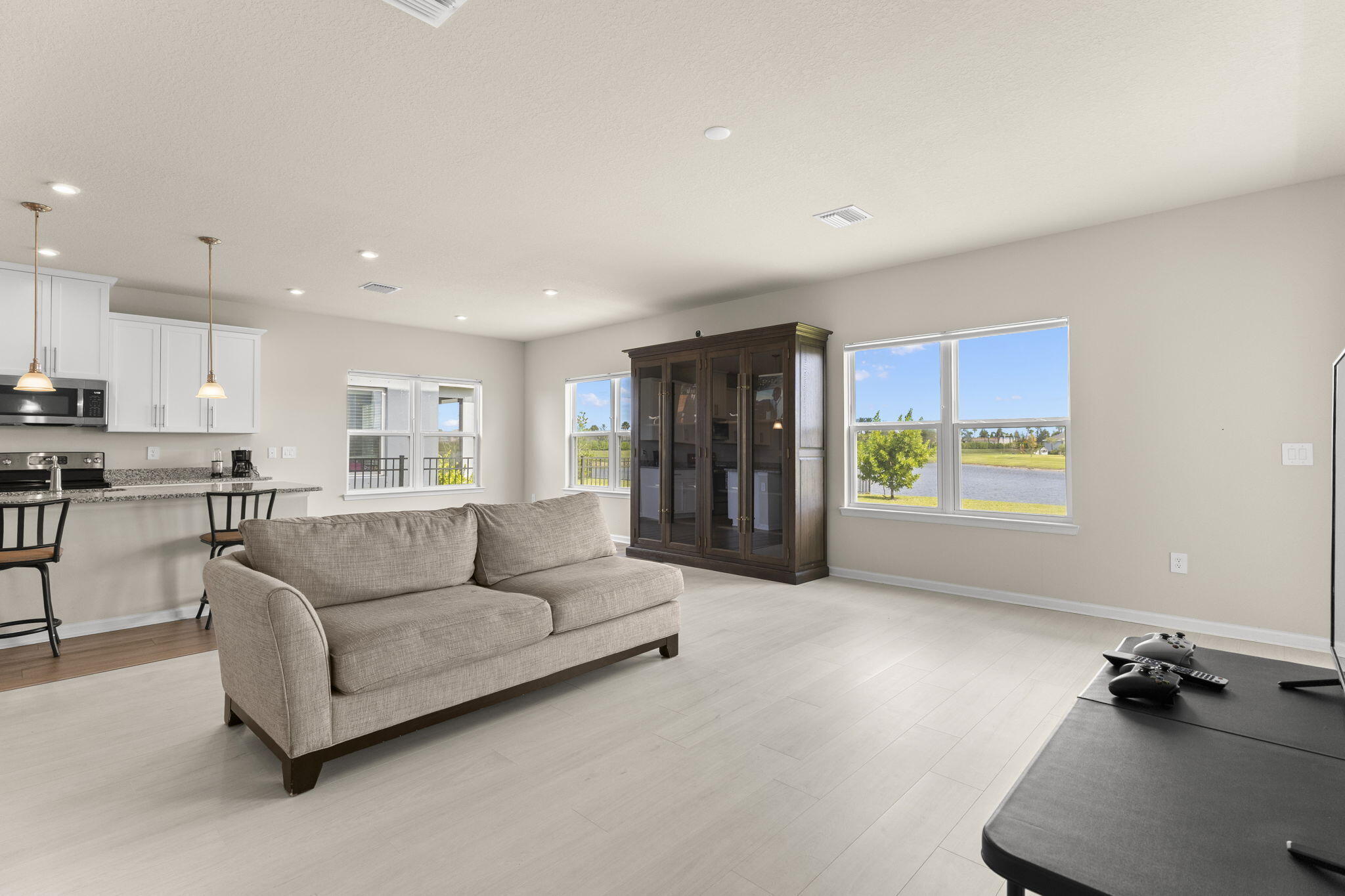 12291 Southwest Forli Way Port St. Lucie, FL 34987 - Photo 13 of 47 a living room with furniture and a large window