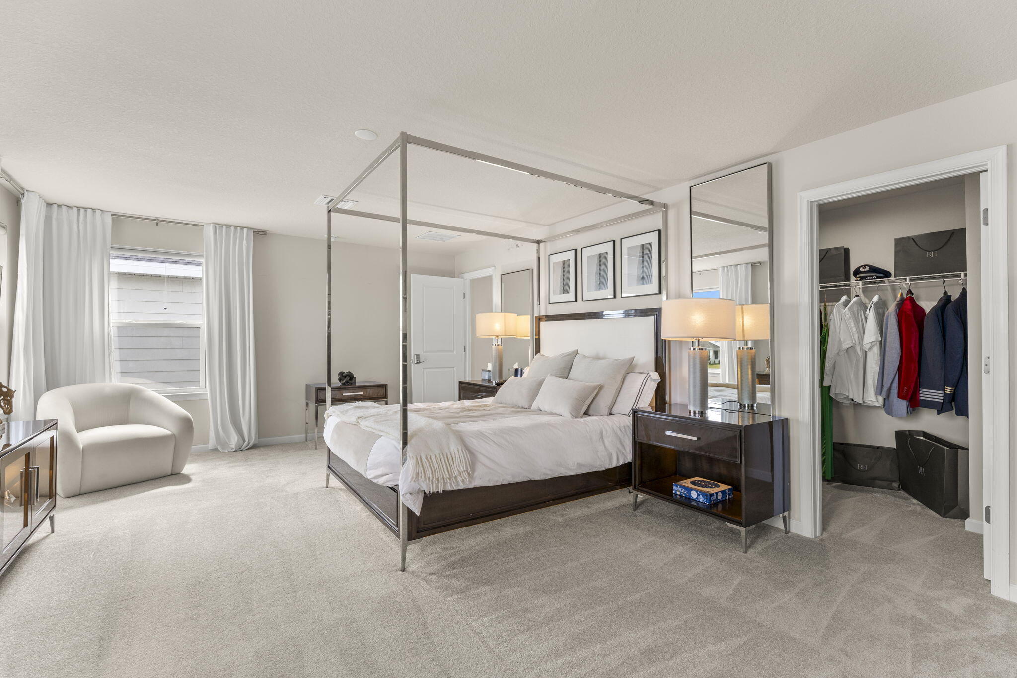 12291 Southwest Forli Way Port St. Lucie, FL 34987 - Photo 22 of 47 a spacious bedroom with a bed and a couch