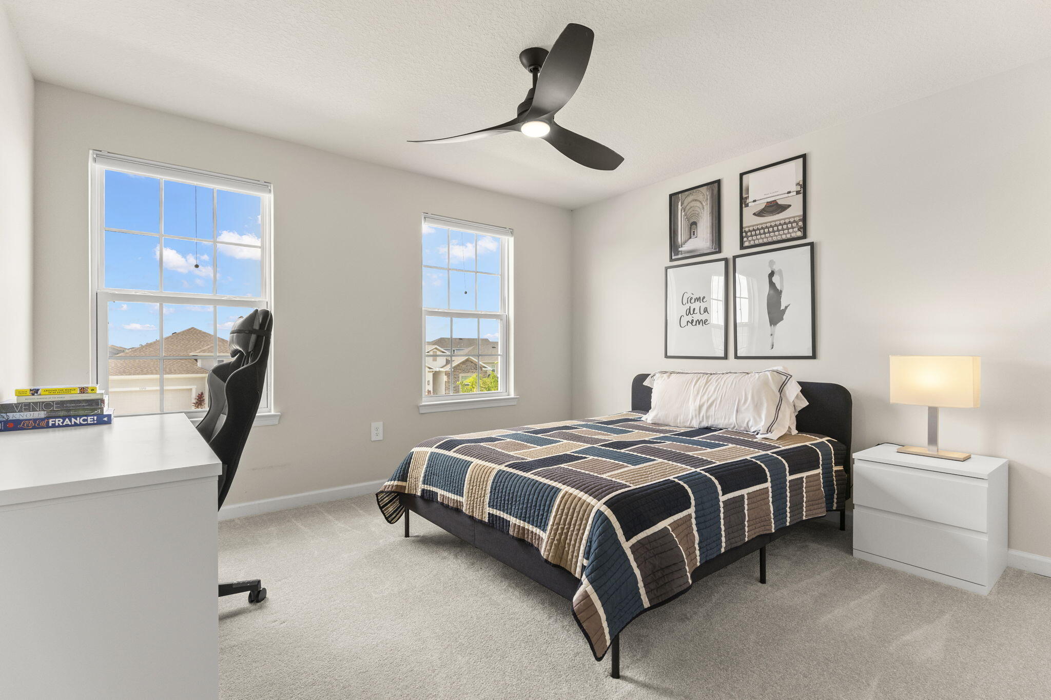 12291 Southwest Forli Way Port St. Lucie, FL 34987 - Photo 28 of 47 a bedroom with a bed a couch and a window