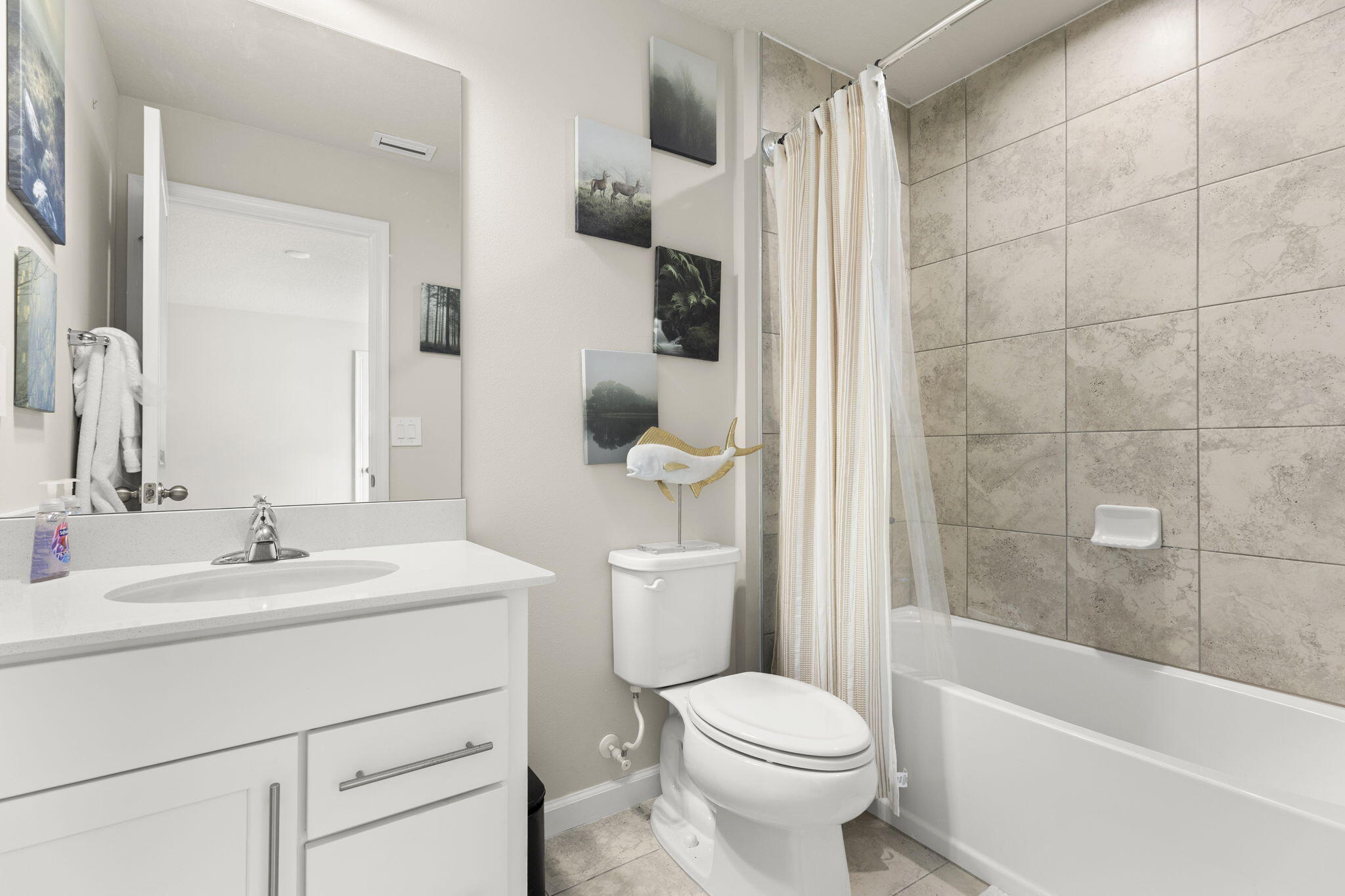 12291 Southwest Forli Way Port St. Lucie, FL 34987 - Photo 31 of 47 a bathroom with a sink a toilet and shower