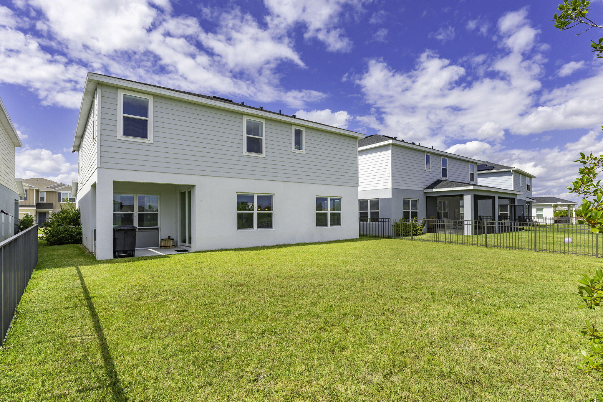 12291 Southwest Forli Way Port St. Lucie, FL 34987 - Photo 32 of 47 a front view of a house with a garden