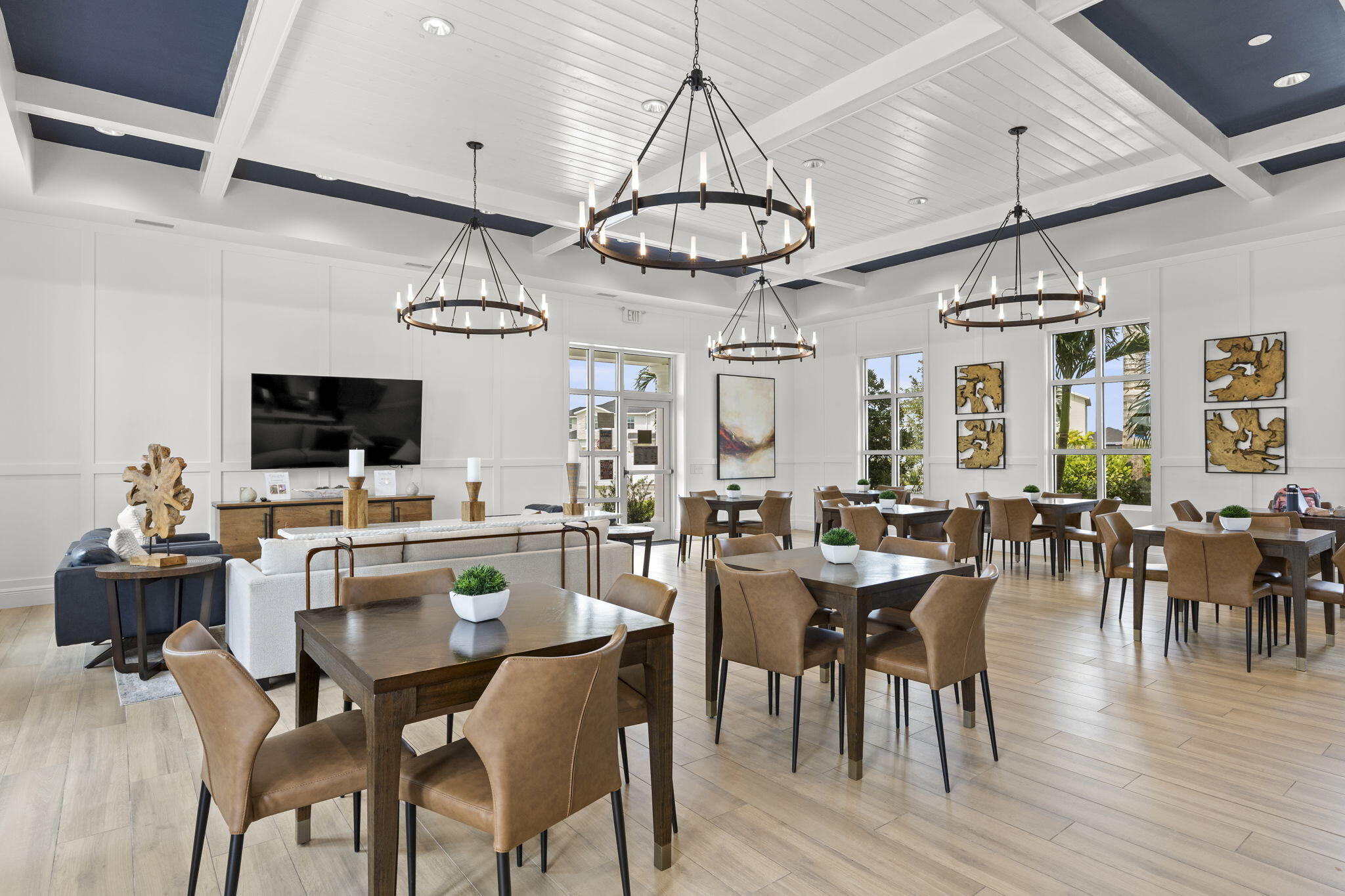 12291 Southwest Forli Way Port St. Lucie, FL 34987 - Photo 44 of 47 a view of a dining room with furniture wooden floor and chandelier