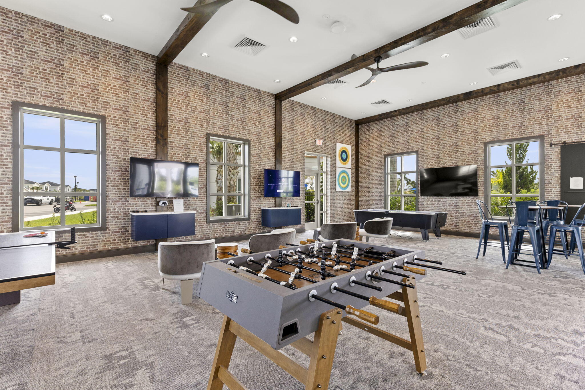 12291 Southwest Forli Way Port St. Lucie, FL 34987 - Photo 45 of 47 a living room with furniture dining table and a fireplace