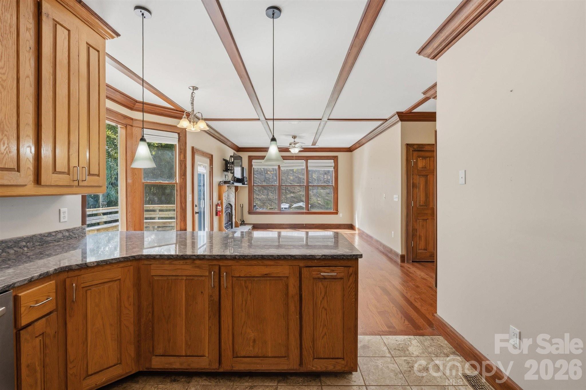 22 Pear Tree Lane Leicester, NC 28748 - Photo 12 of 47 a view of a kitchen with granite countertop cabinets and wooden floor