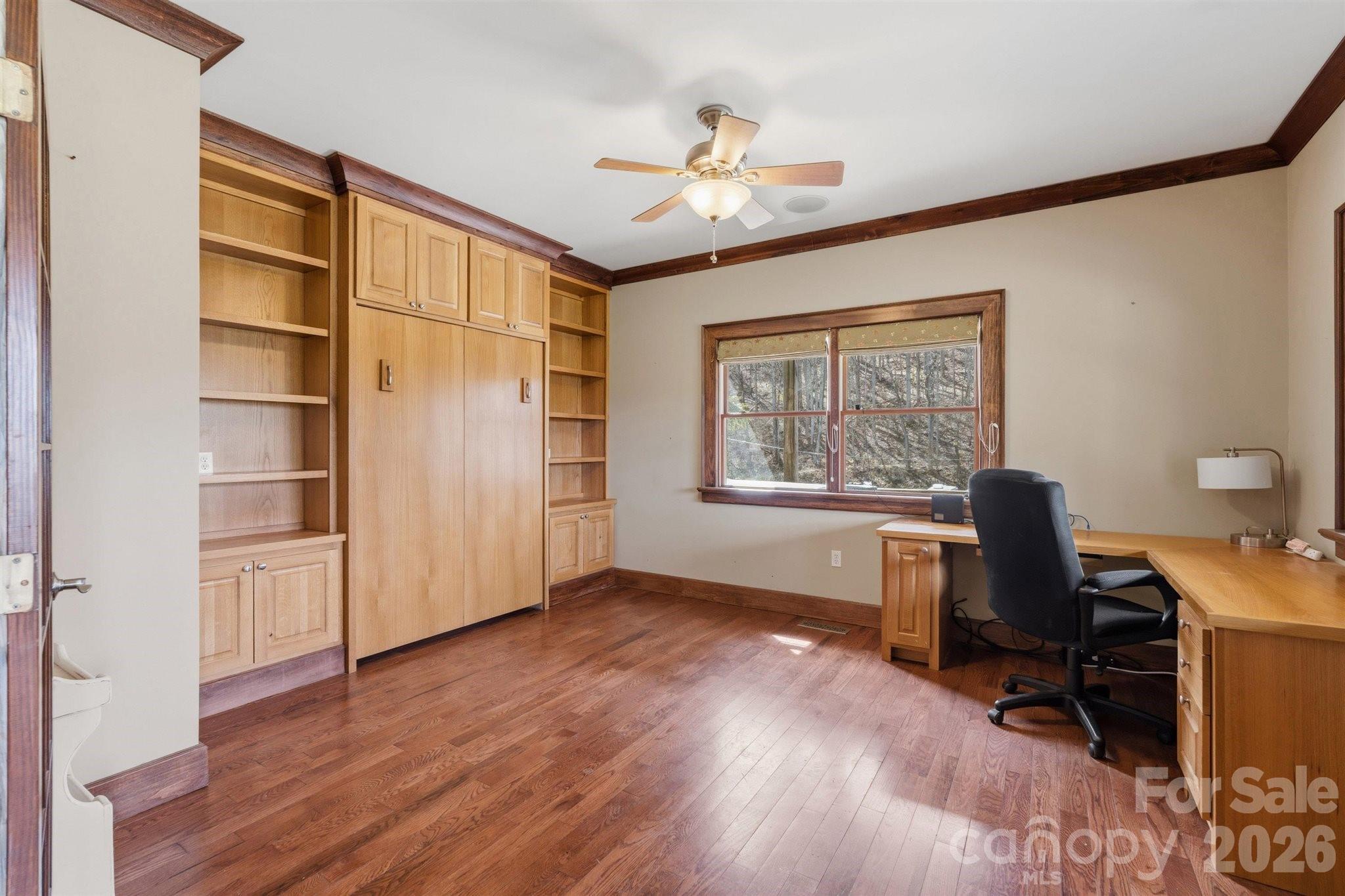 22 Pear Tree Lane Leicester, NC 28748 - Photo 15 of 47 a view of a workspace with furniture and a window