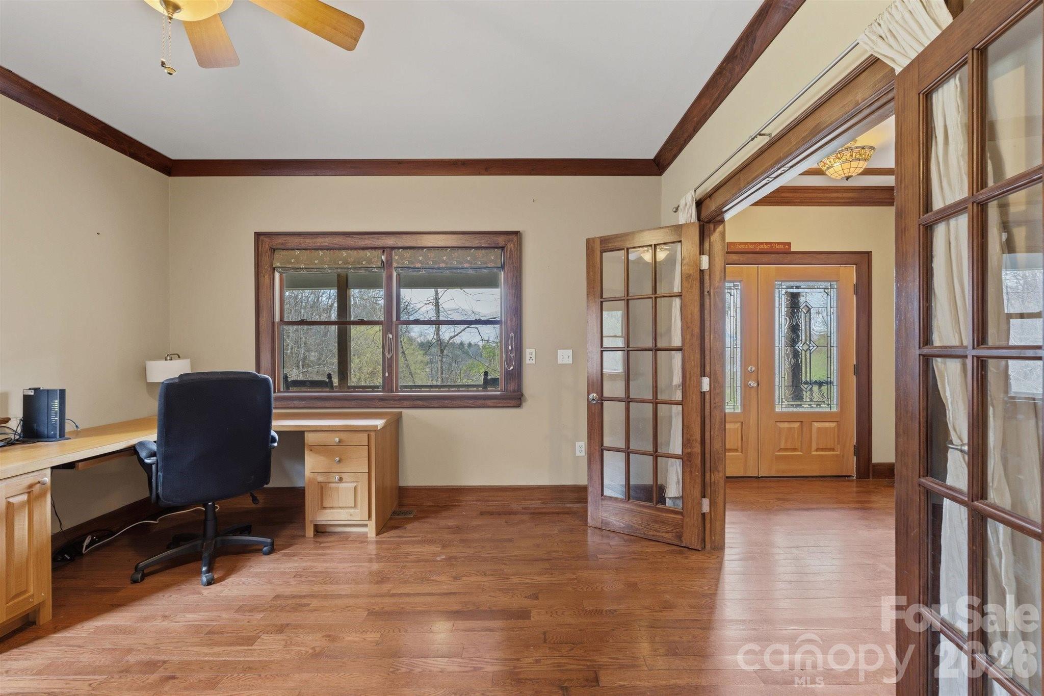 22 Pear Tree Lane Leicester, NC 28748 - Photo 17 of 47 a view of workspace with wooden floor and windows