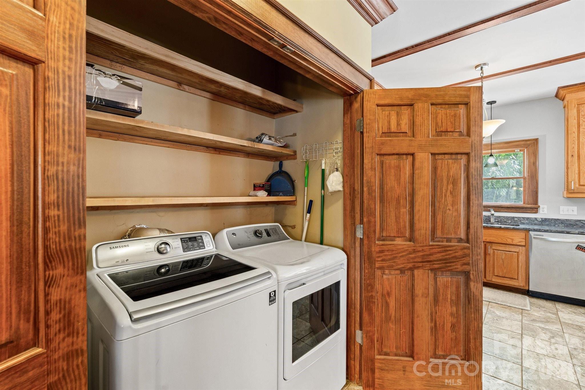 22 Pear Tree Lane Leicester, NC 28748 - Photo 18 of 47 a utility room with dryer and washer