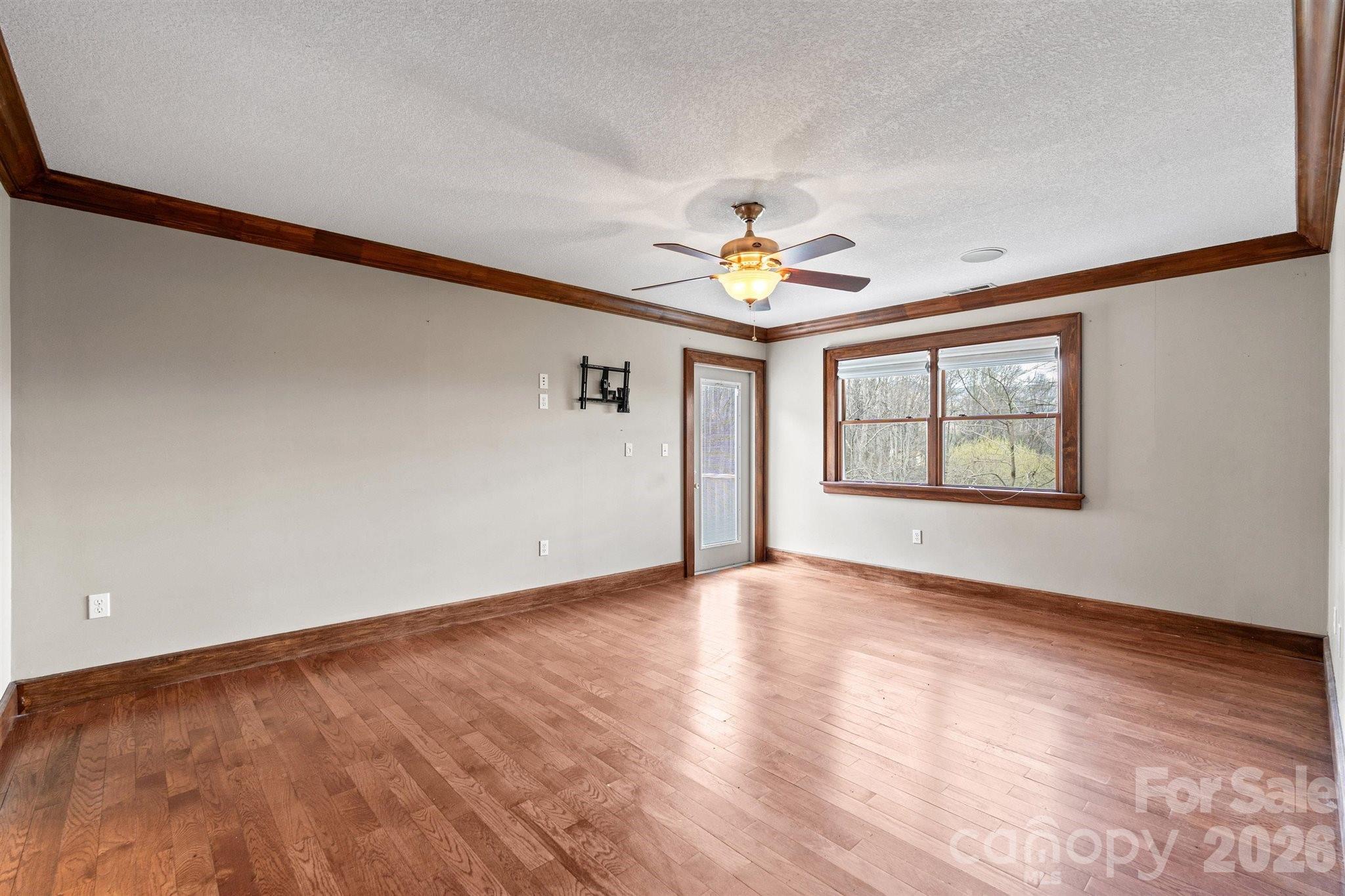 22 Pear Tree Lane Leicester, NC 28748 - Photo 19 of 47 wooden floor in an empty room with a window