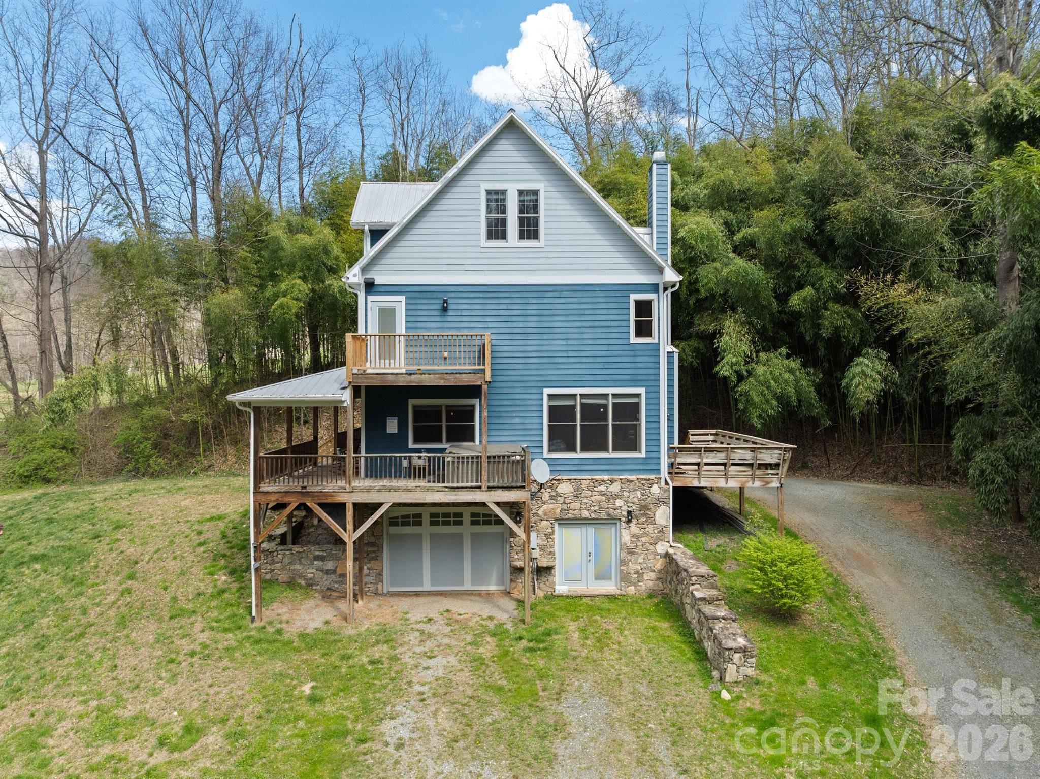 22 Pear Tree Lane Leicester, NC 28748 - Photo 2 of 47 a front view of a house with garden