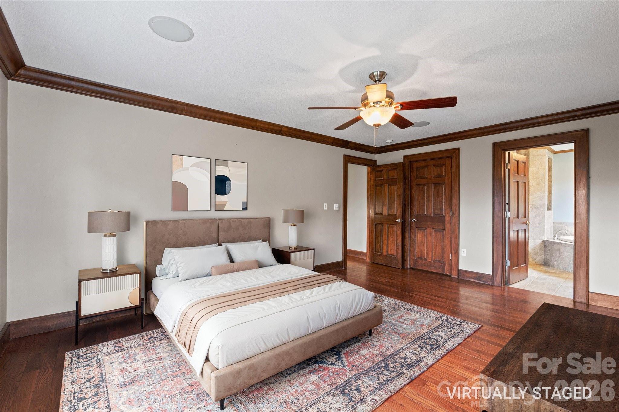 22 Pear Tree Lane Leicester, NC 28748 - Photo 21 of 47 a bedroom with a bed and a chandelier