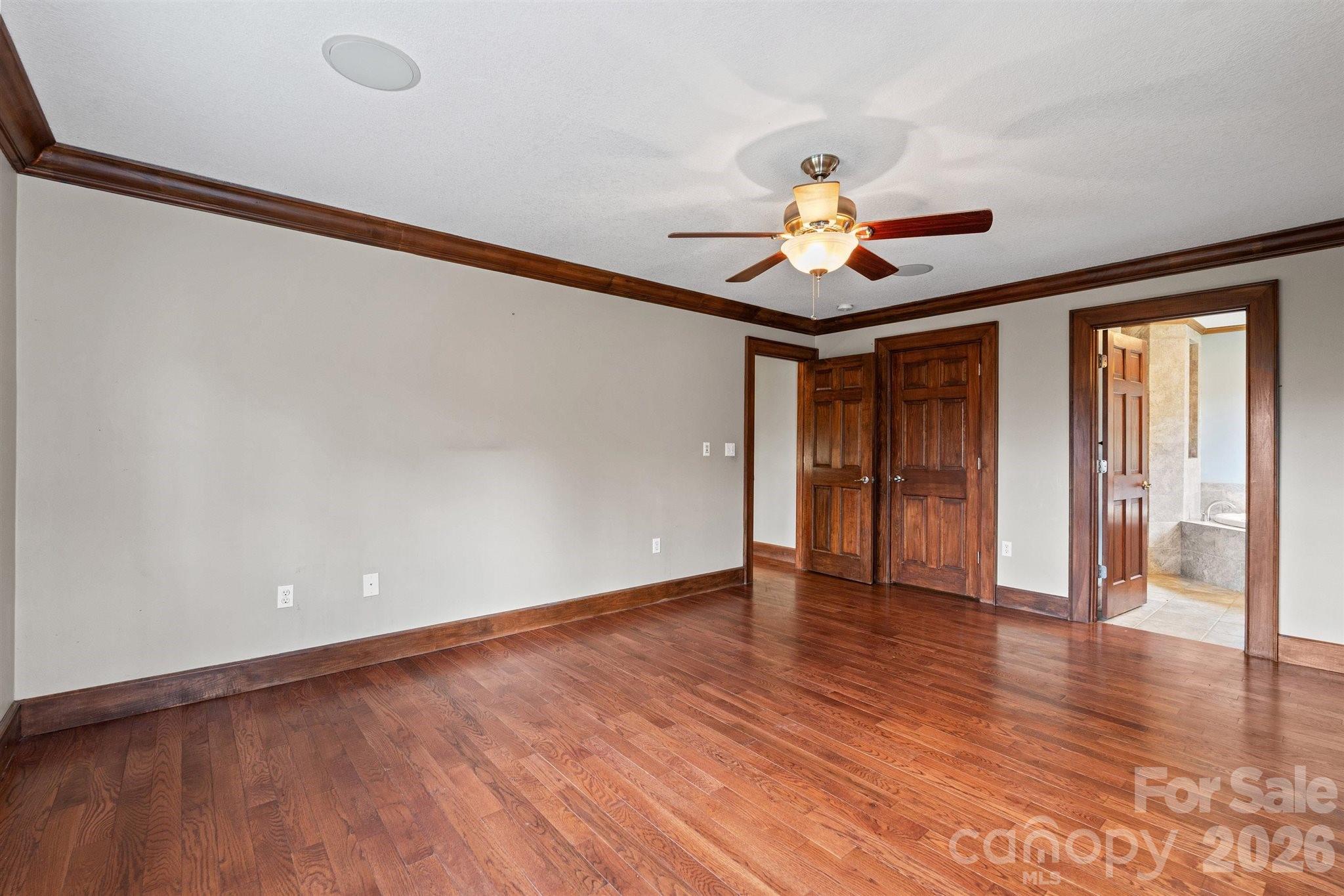 22 Pear Tree Lane Leicester, NC 28748 - Photo 22 of 47 a view of an empty room with window and wooden floor