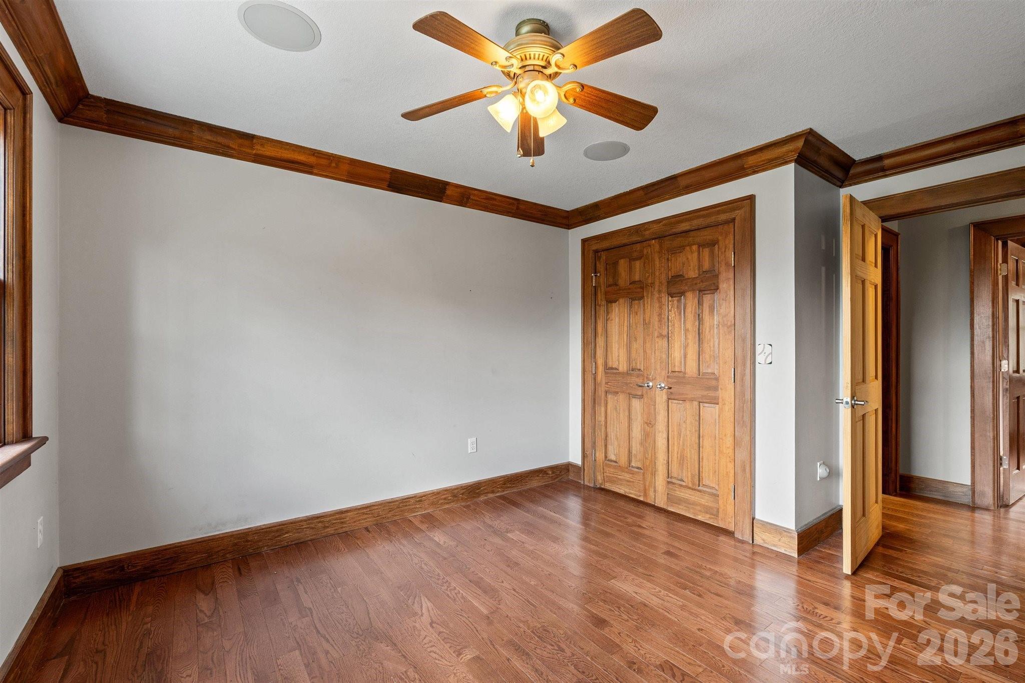 22 Pear Tree Lane Leicester, NC 28748 - Photo 25 of 47 a view of a room with wooden floor and a ceiling fan