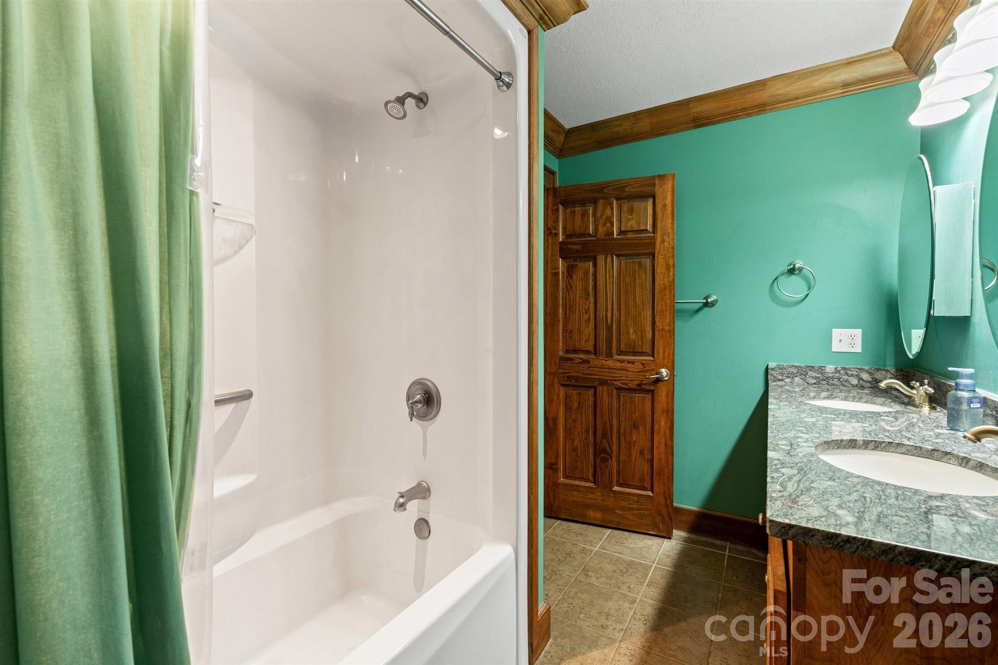 22 Pear Tree Lane Leicester, NC 28748 - Photo 27 of 47 a bathroom with a granite countertop sink and a mirror