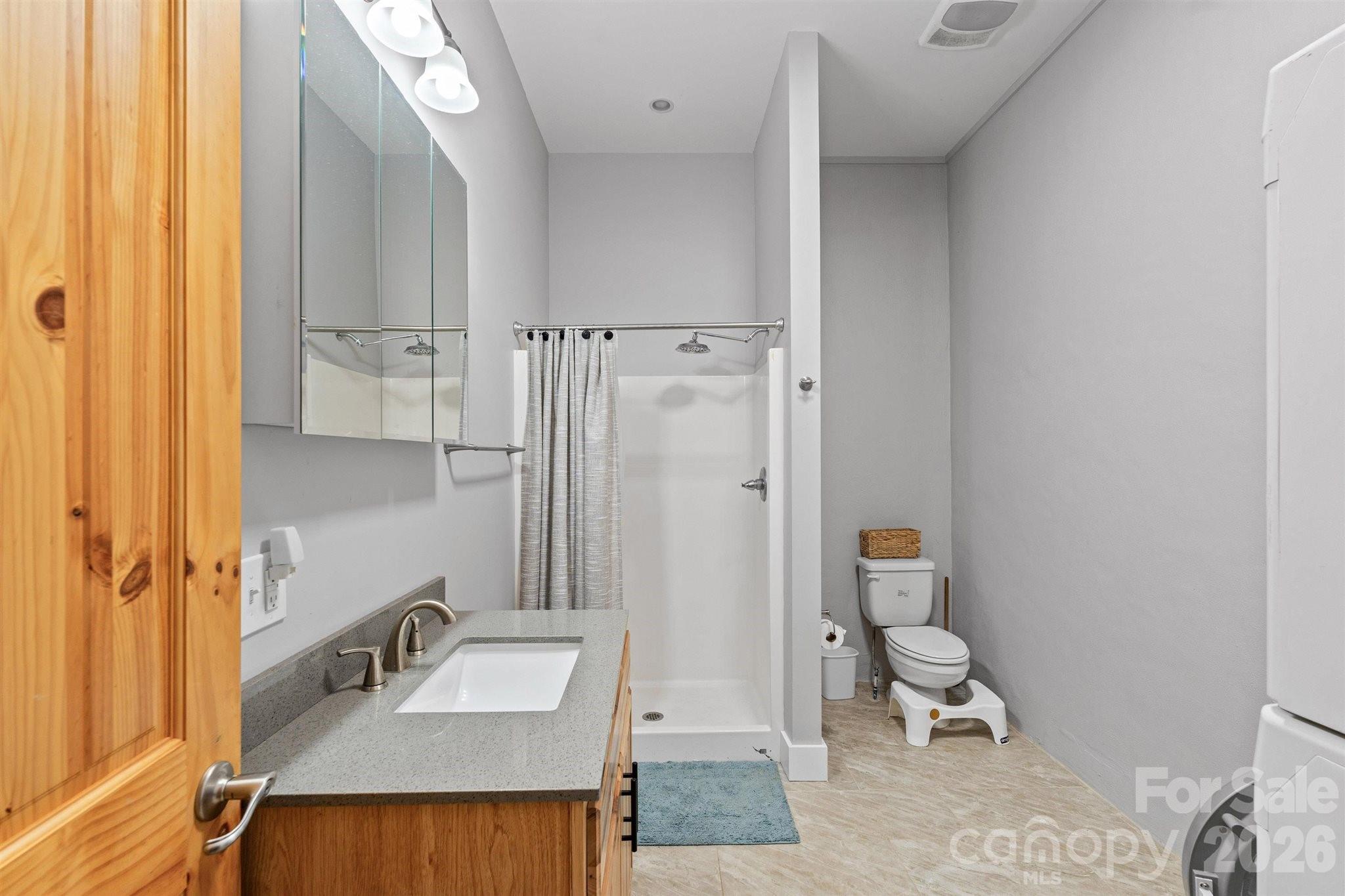22 Pear Tree Lane Leicester, NC 28748 - Photo 40 of 47 a bathroom with a sink toilet and shower