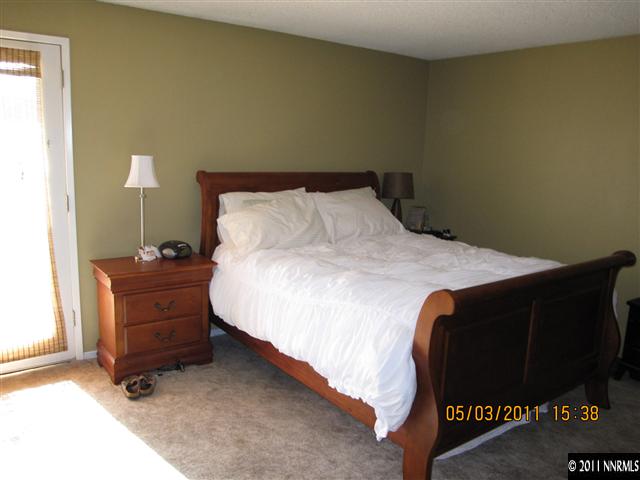 14595 Geronimo Trail Reno, NV 89521 - Photo 11 of 13 a bed sitting in a bedroom and dresser