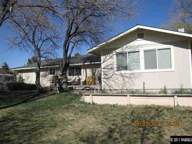 14595 Geronimo Trail Reno, NV 89521 - Photo 13 of 13 a front view of a house with garden