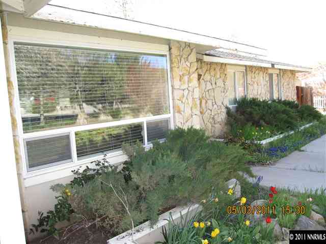 14595 Geronimo Trail Reno, NV 89521 - Photo 2 of 13 a view of backyard with garden and plants