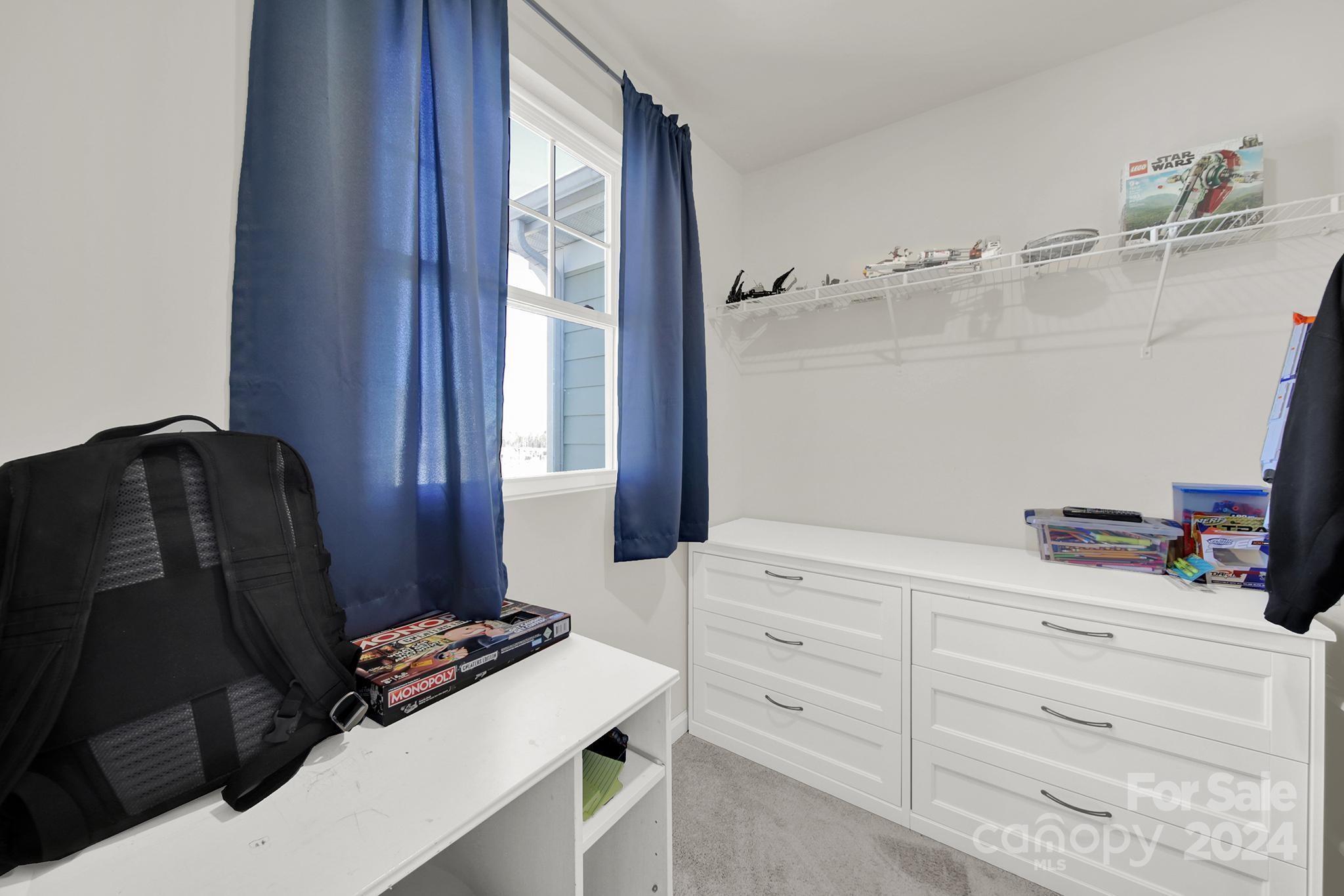 1639 Corwin Bend Road Tega Cay, SC 29708 - Photo 23 of 47 a room with a closet and a mirror