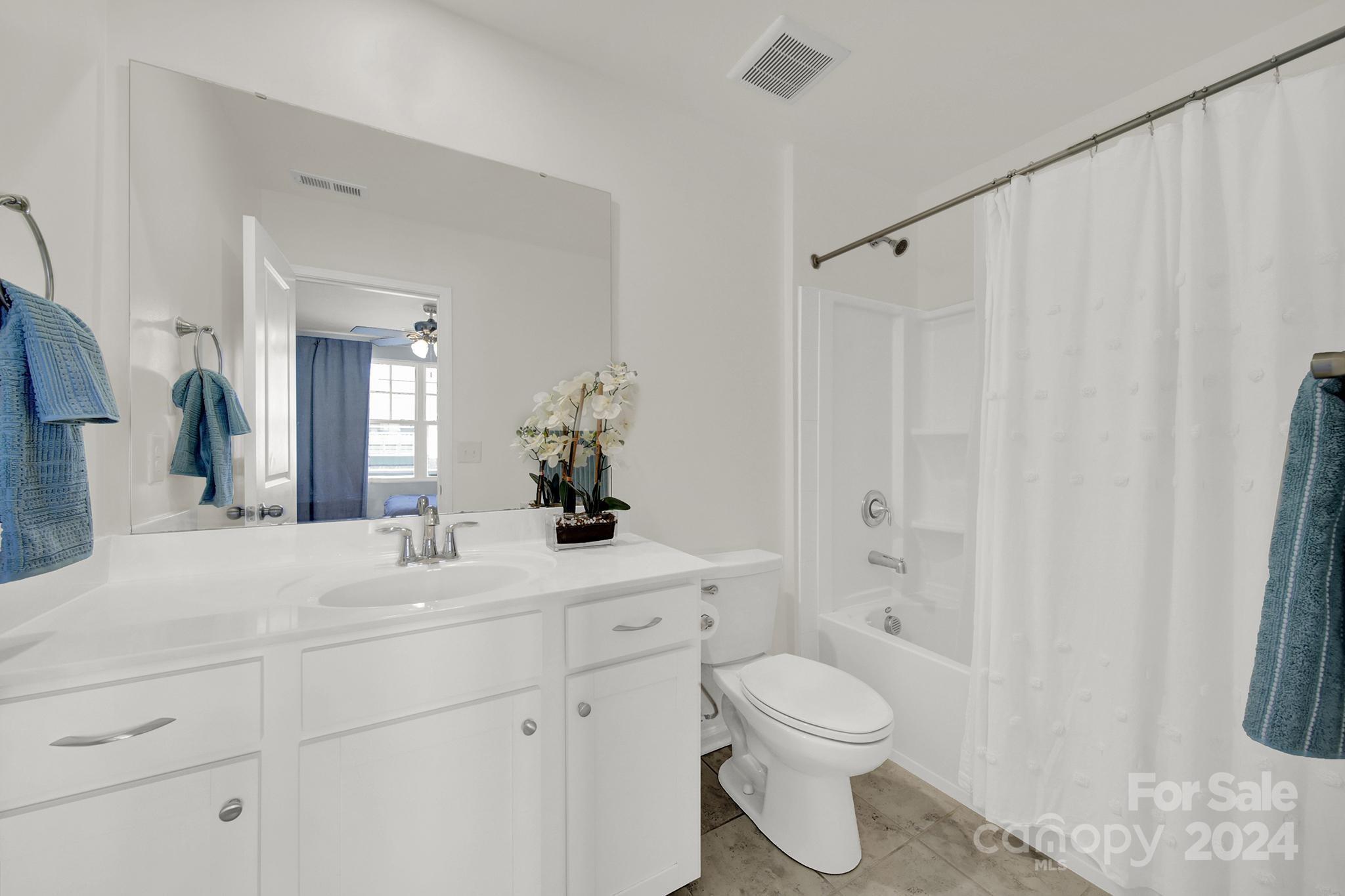 1639 Corwin Bend Road Tega Cay, SC 29708 - Photo 24 of 47 a bathroom with a sink a toilet and shower