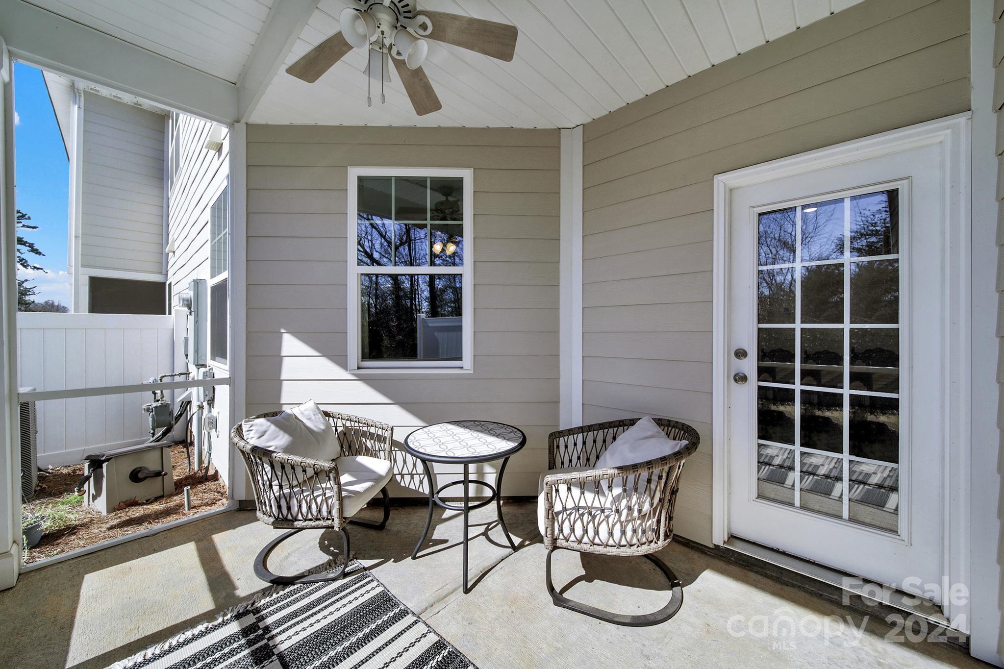 1639 Corwin Bend Road Tega Cay, SC 29708 - Photo 27 of 47 a view of a chairs and table in the patio