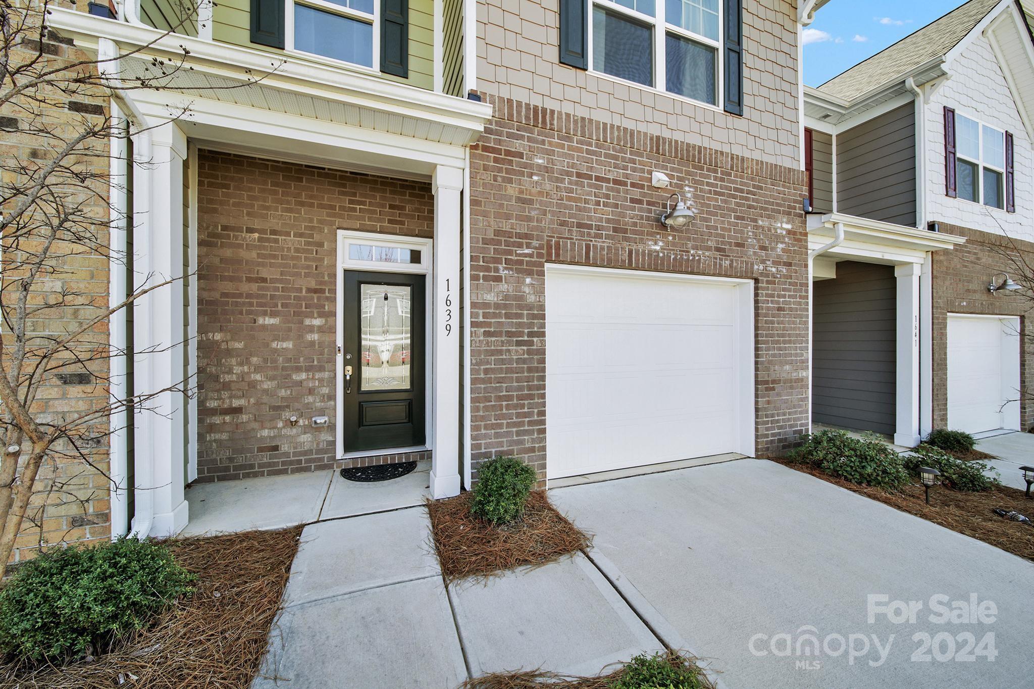 1639 Corwin Bend Road Tega Cay, SC 29708 - Photo 3 of 47 a front view of a house