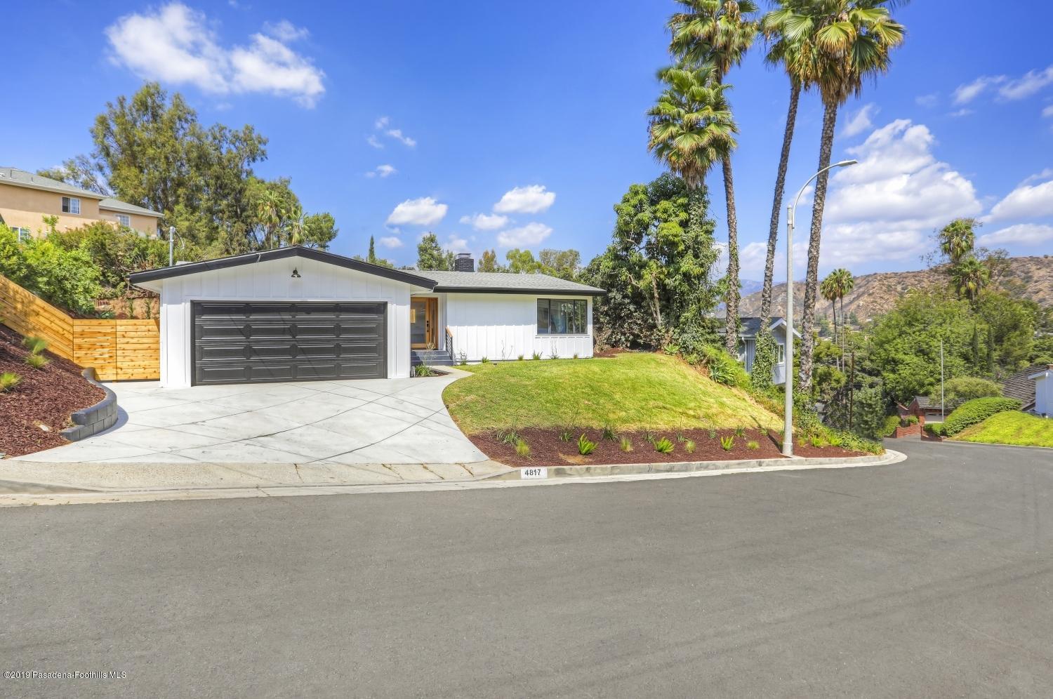 4817 Lockhaven Avenue Los Angeles, CA 90041 - Photo 2 of 34 a view of a house with a yard and garage