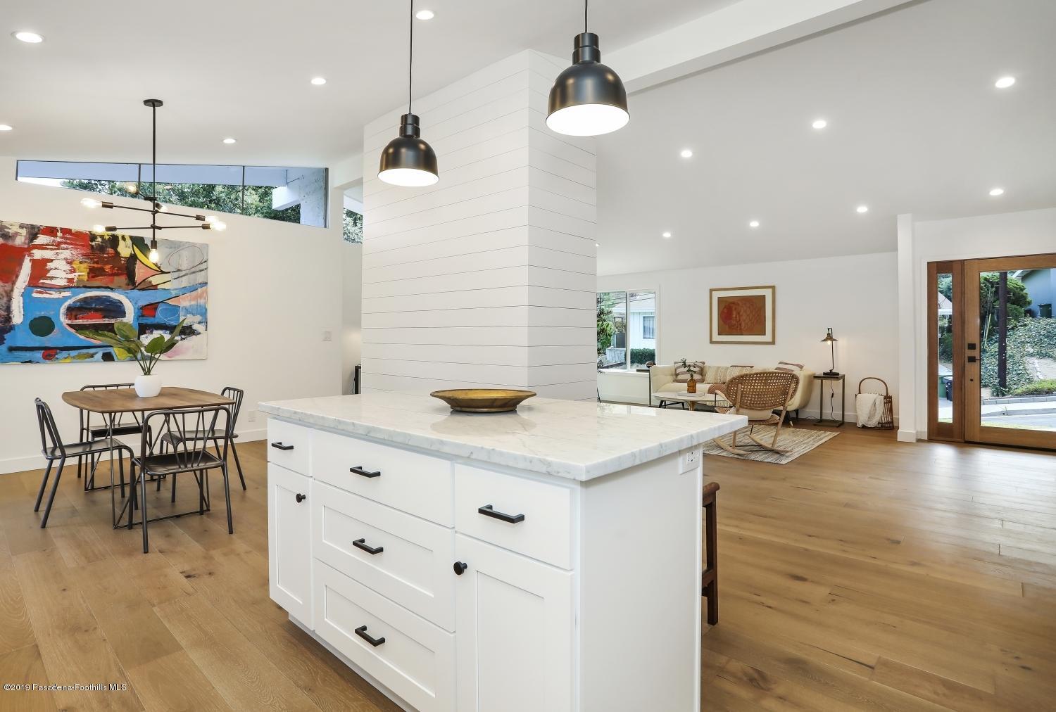 4817 Lockhaven Avenue Los Angeles, CA 90041 - Photo 15 of 34 a kitchen with stainless steel appliances granite countertop a stove and a refrigerator