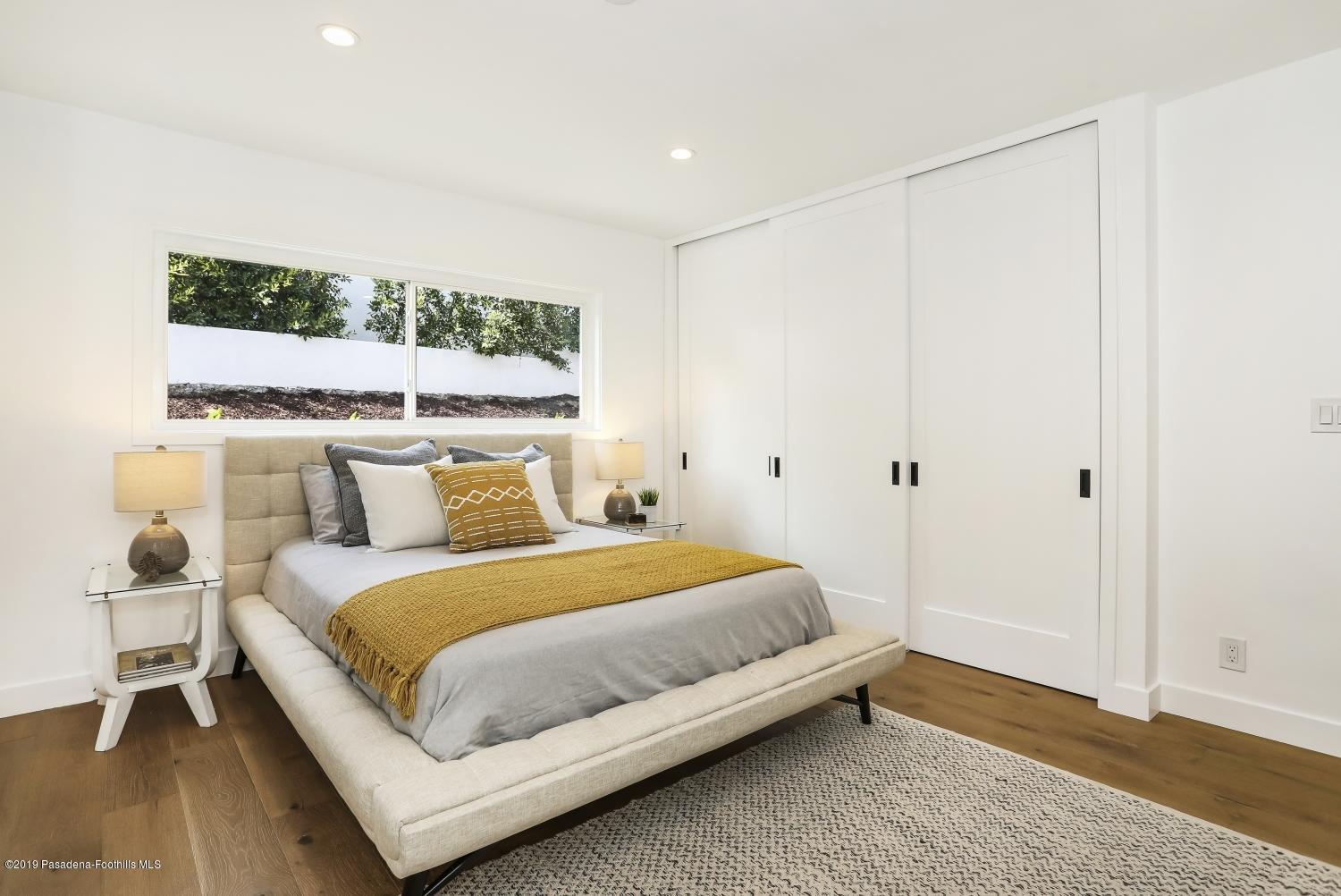 4817 Lockhaven Avenue Los Angeles, CA 90041 - Photo 17 of 34 a bedroom with a bed and window