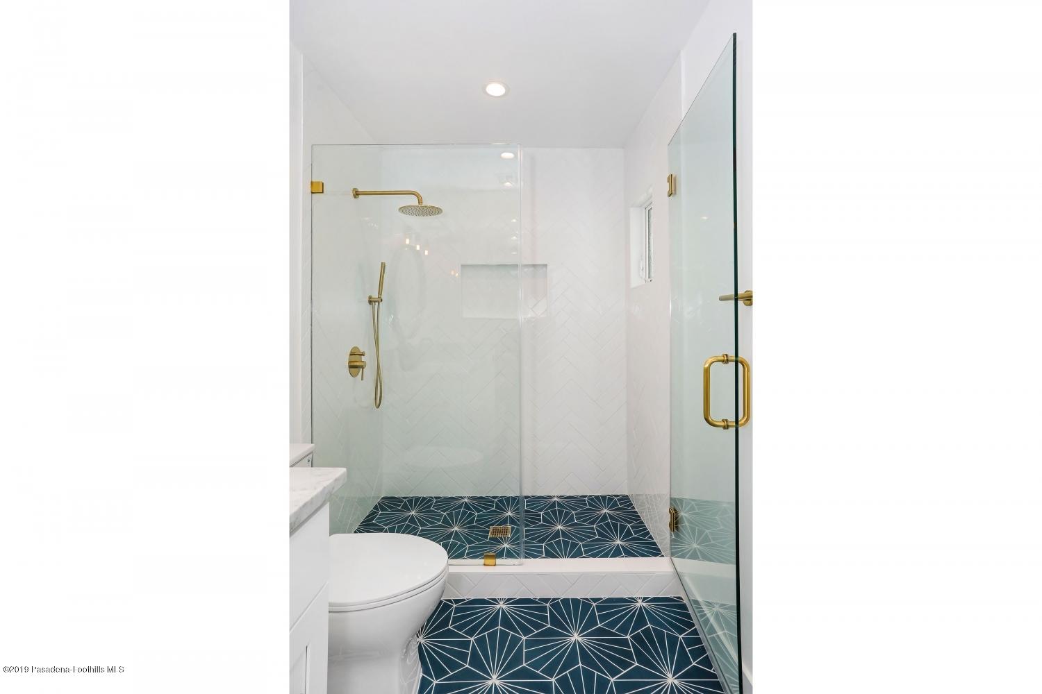 4817 Lockhaven Avenue Los Angeles, CA 90041 - Photo 20 of 34 a bathroom with a sink and a toilet