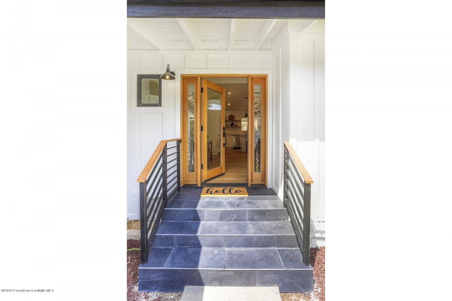 4817 Lockhaven Avenue Los Angeles, CA 90041 - Photo 3 of 34 a view of a hallway with wooden floor