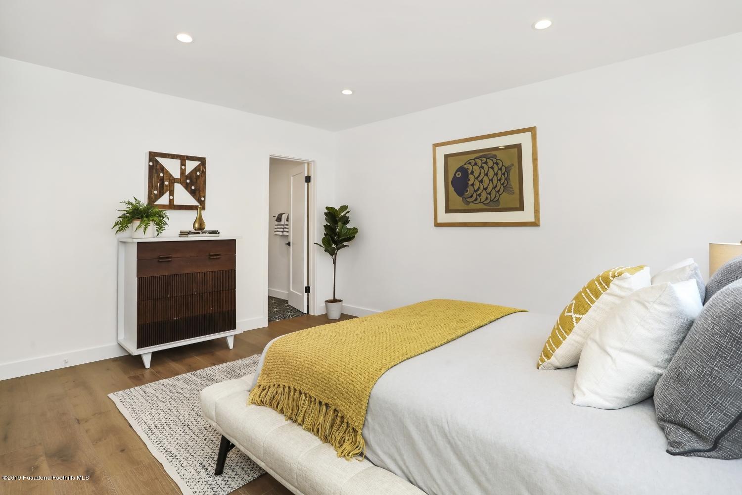 4817 Lockhaven Avenue Los Angeles, CA 90041 - Photo 21 of 34 a bedroom with a bed and a desk