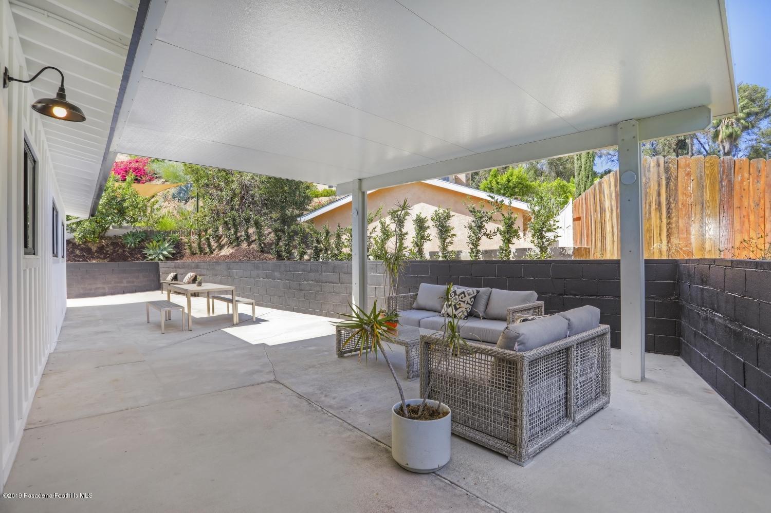 4817 Lockhaven Avenue Los Angeles, CA 90041 - Photo 29 of 34 a living room with patio furniture and a potted plant