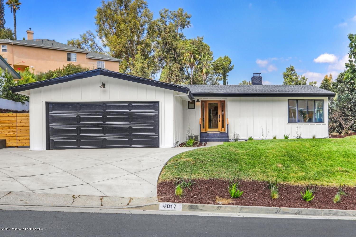4817 Lockhaven Avenue Los Angeles, CA 90041 - Photo 4 of 34 a front view of a house with a yard and garage