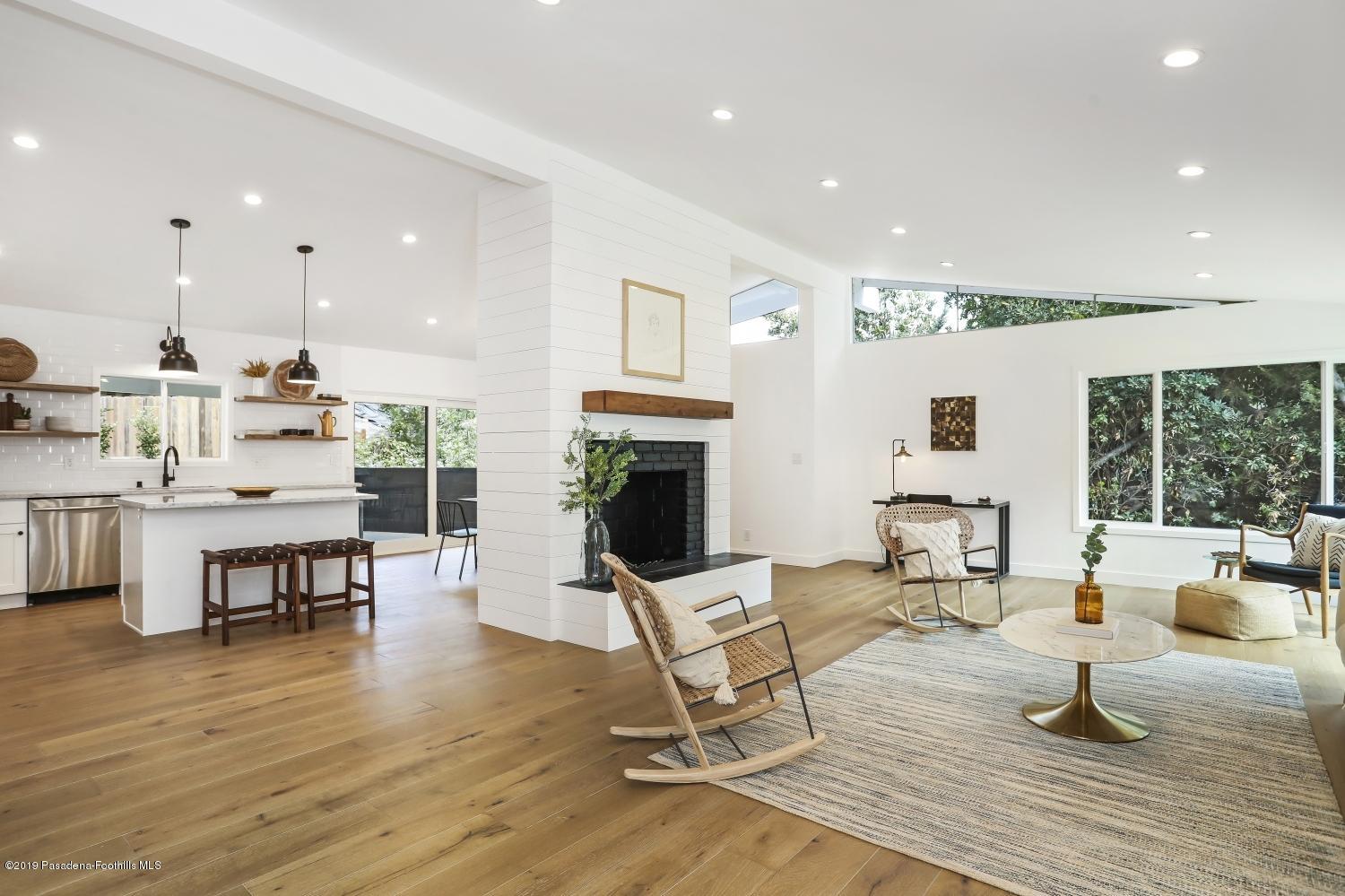 4817 Lockhaven Avenue Los Angeles, CA 90041 - Photo 5 of 34 a living room with furniture and a fireplace