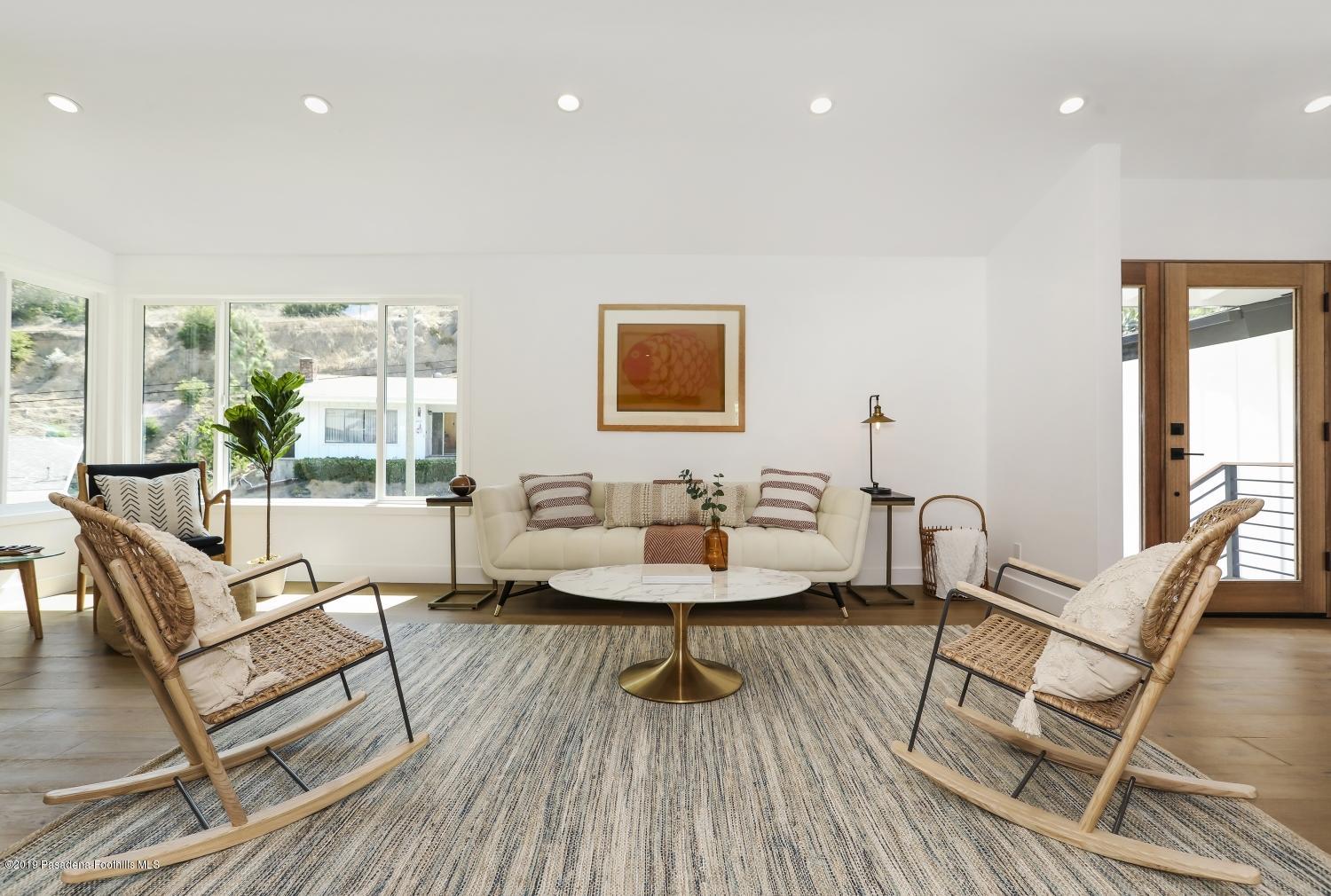 4817 Lockhaven Avenue Los Angeles, CA 90041 - Photo 6 of 34 a living room with furniture and a wooden floor
