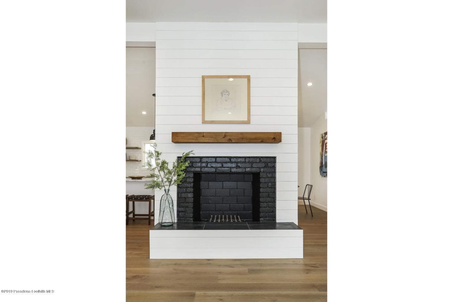 4817 Lockhaven Avenue Los Angeles, CA 90041 - Photo 8 of 34 a living room with a fireplace