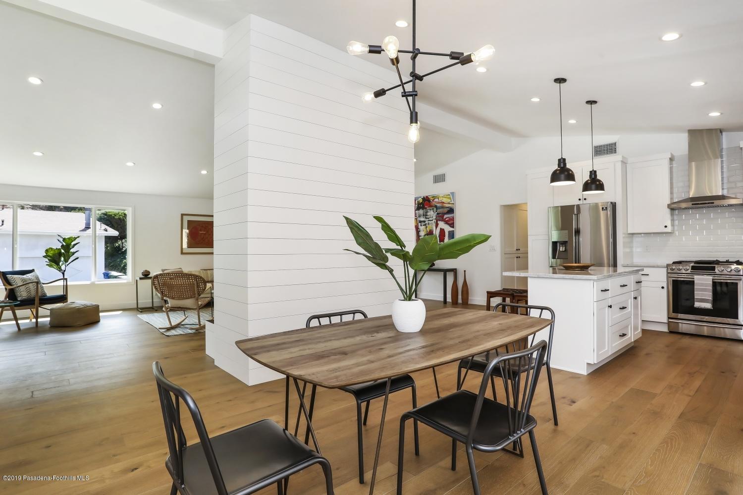 4817 Lockhaven Avenue Los Angeles, CA 90041 - Photo 9 of 34 a view of a dining room with furniture and wooden floor