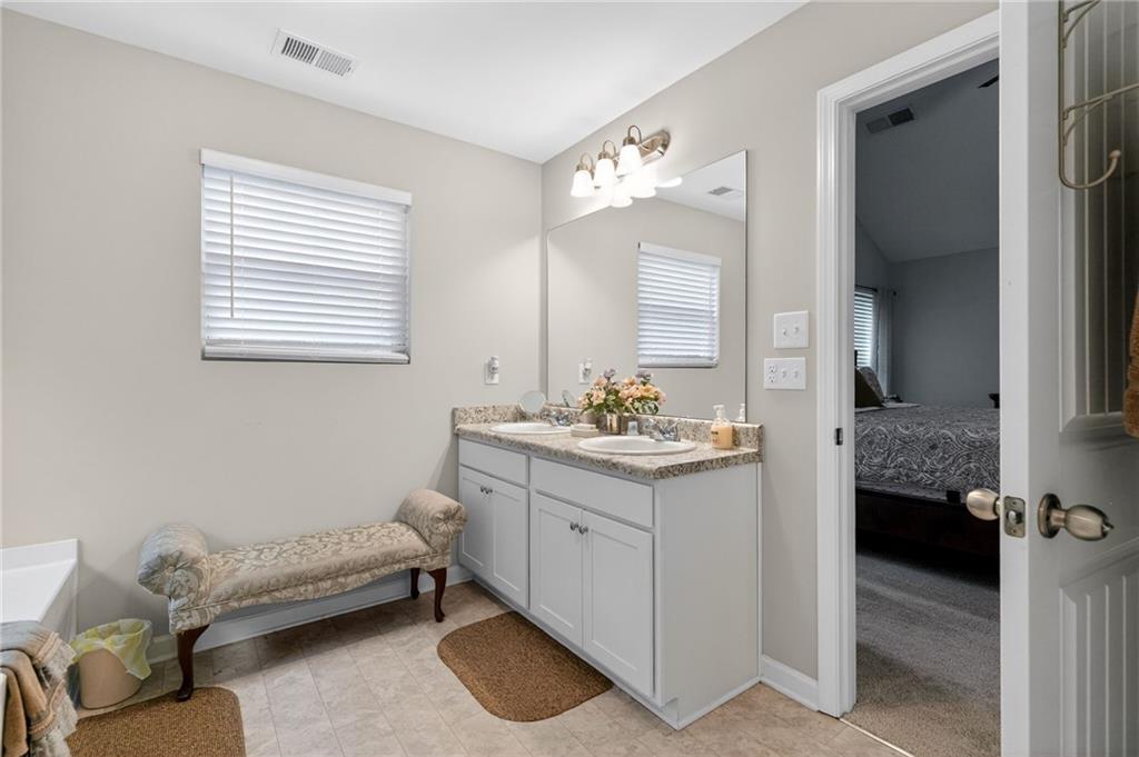 353 Daffodil Drive Temple, GA 30179 - Photo 18 of 30 a bathroom with a sink and a mirror
