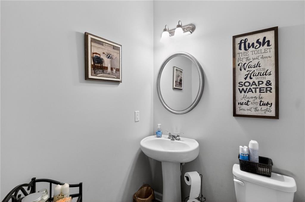 353 Daffodil Drive Temple, GA 30179 - Photo 19 of 30 a bathroom with a toilet and a sink