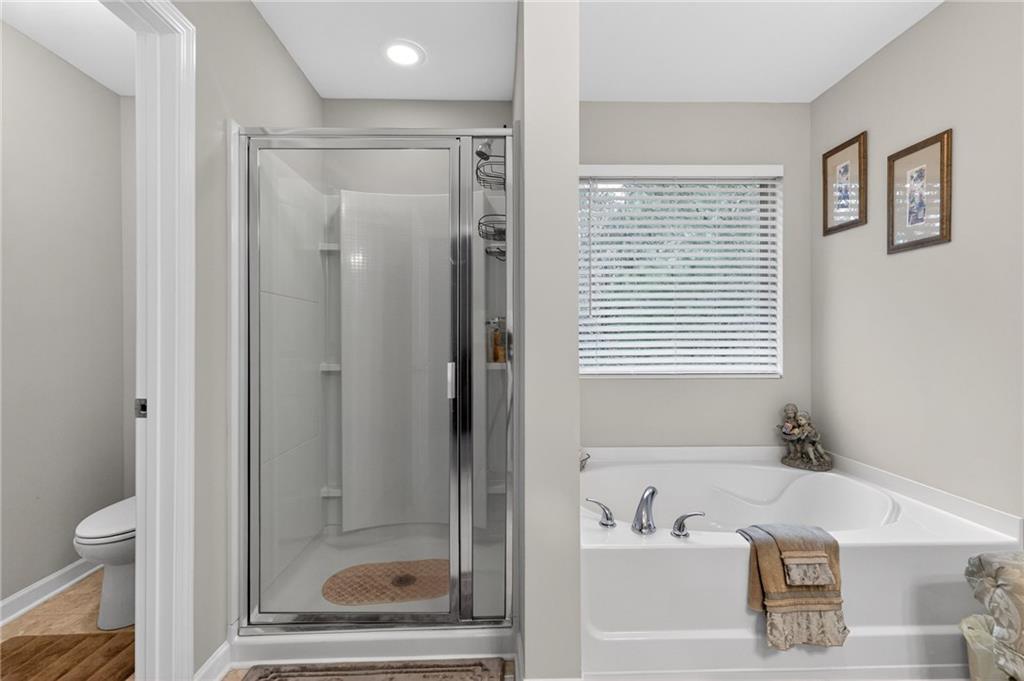 353 Daffodil Drive Temple, GA 30179 - Photo 20 of 30 a bathroom with a bathtub and a shower